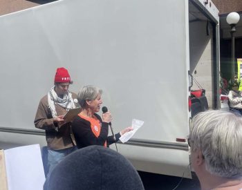 Speaker with microphone at rally