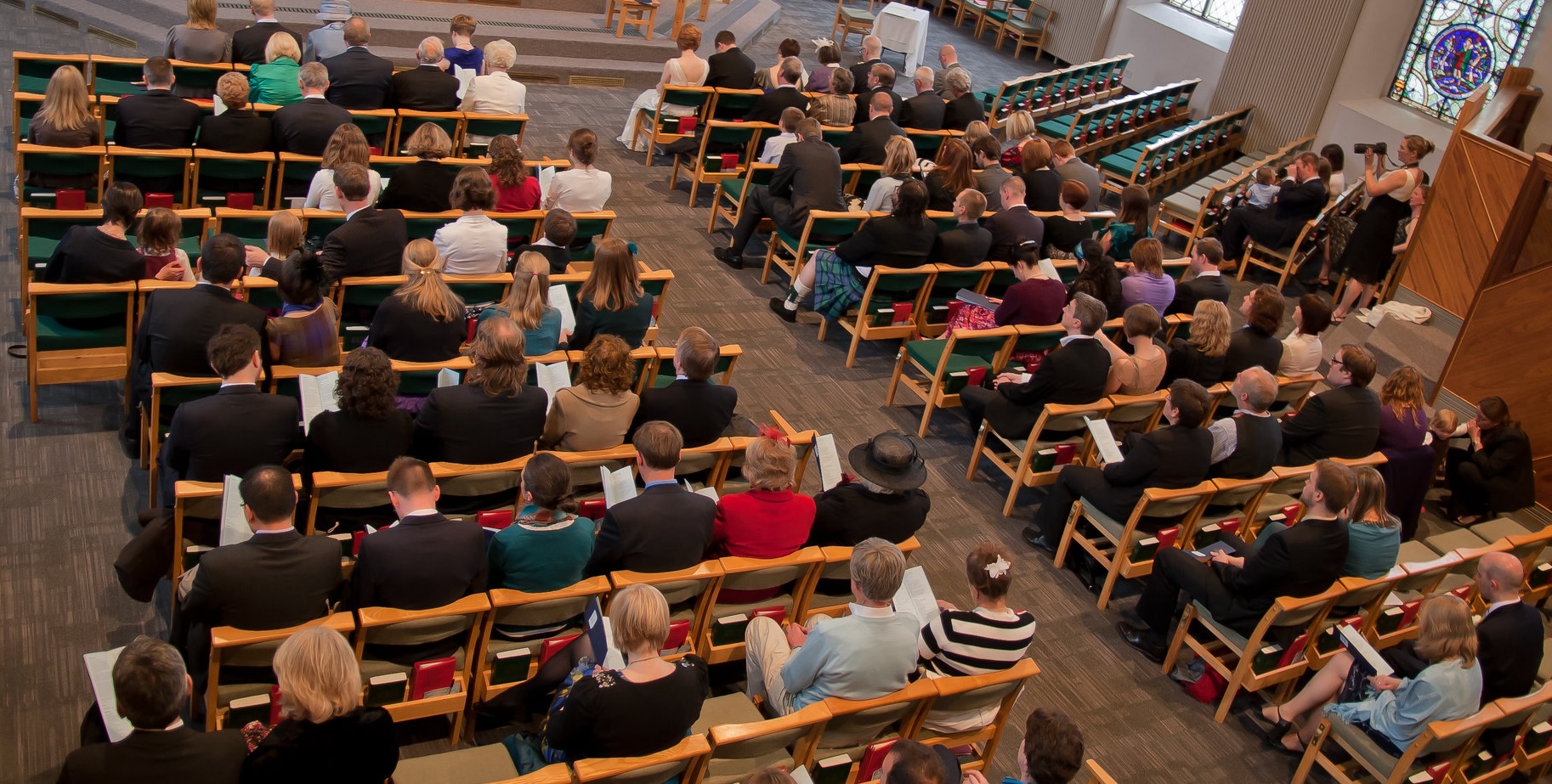 View of people sitting in a congregation.