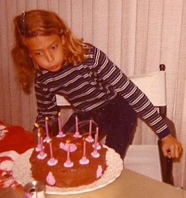 Liz blowing out candles during her birthday